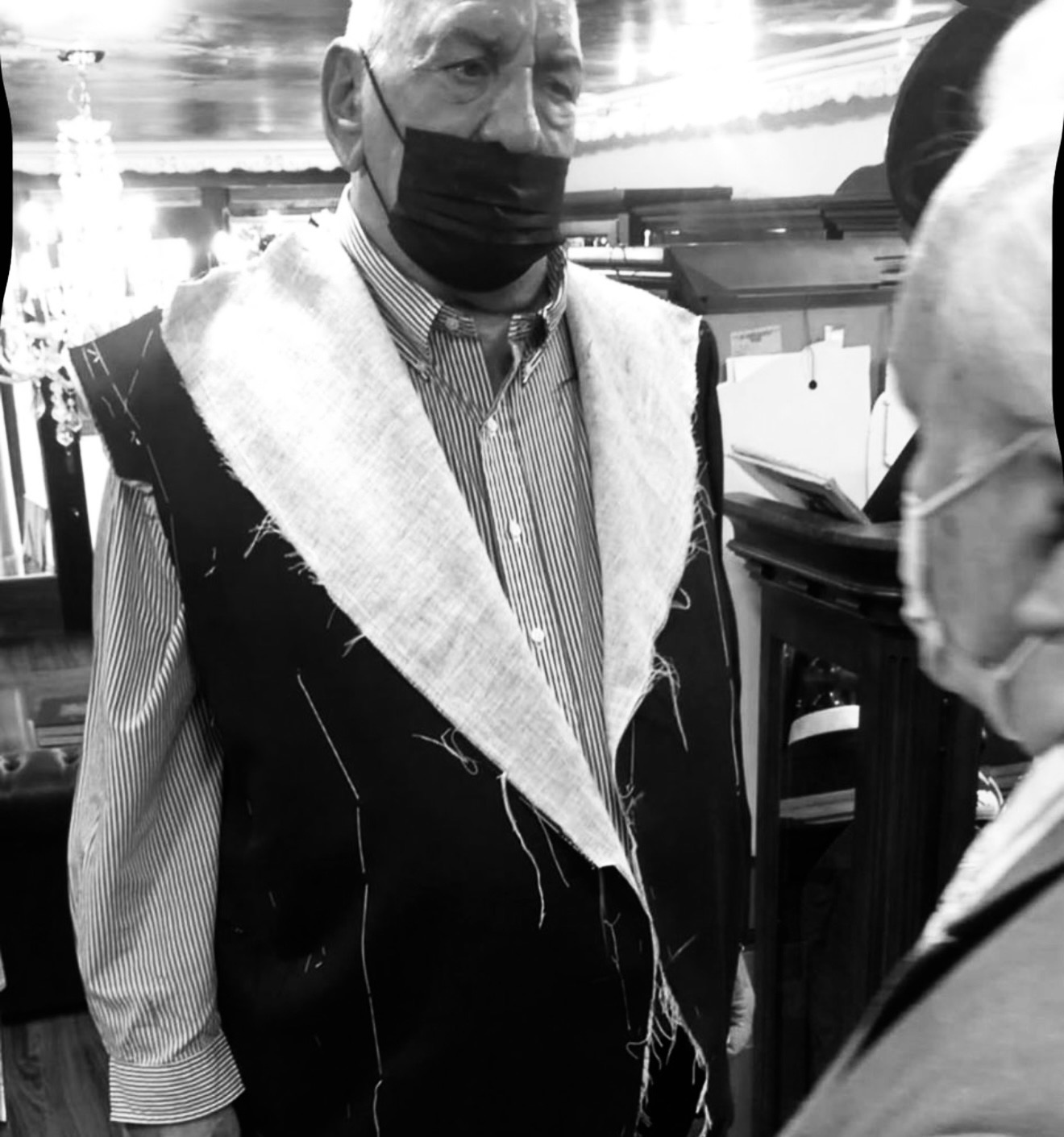 Client being fitted with a hand-canvassed jacket at IK Collection